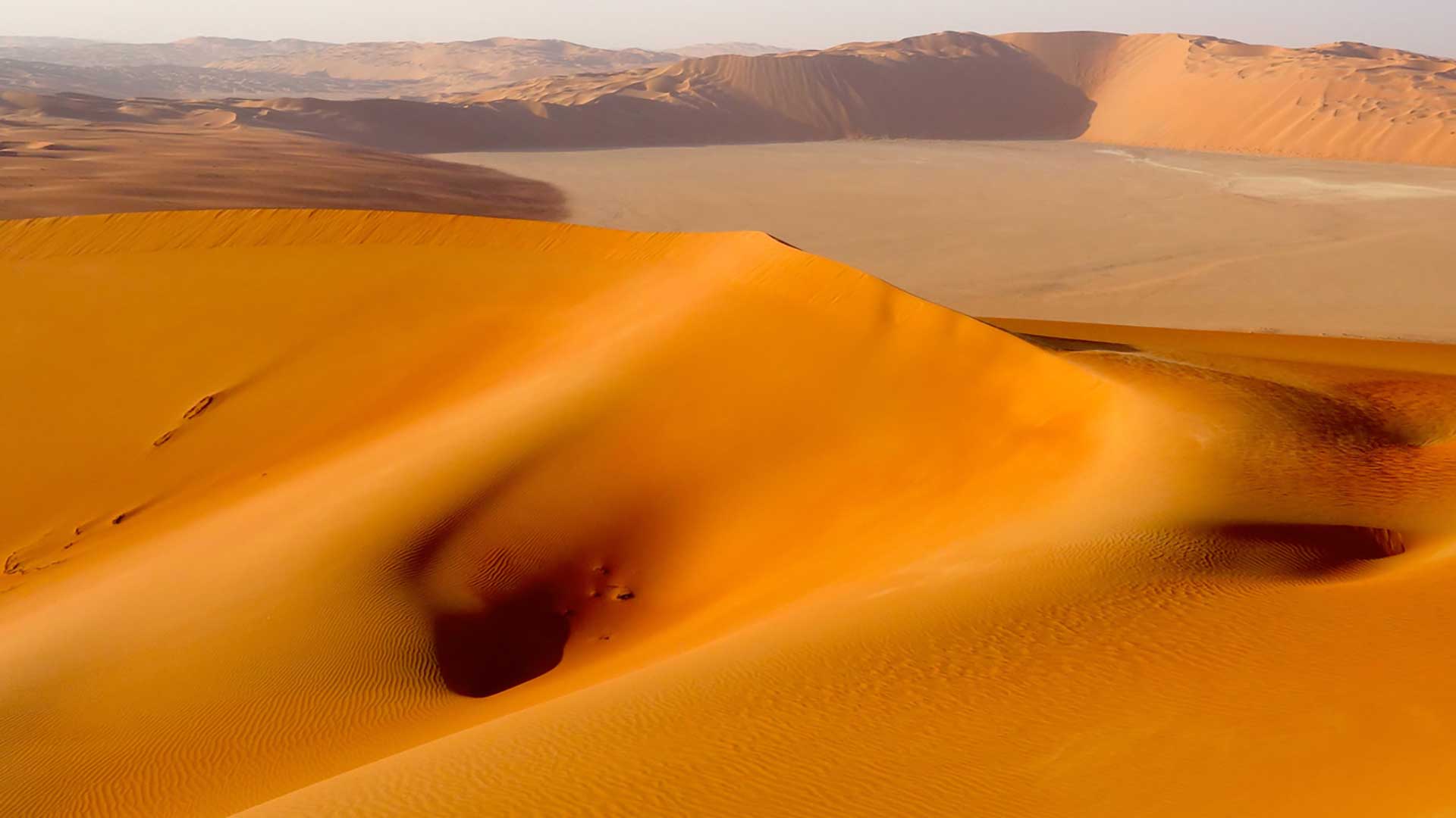 During early exploration, Khamis bin Rimthan guided our geologists across the monochrome deserts.