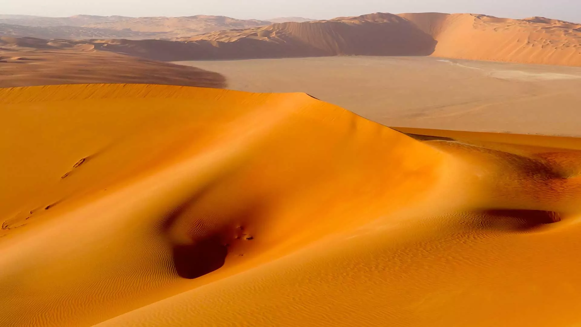 During early exploration, Khamis bin Rimthan guided our geologists across the monochrome deserts.