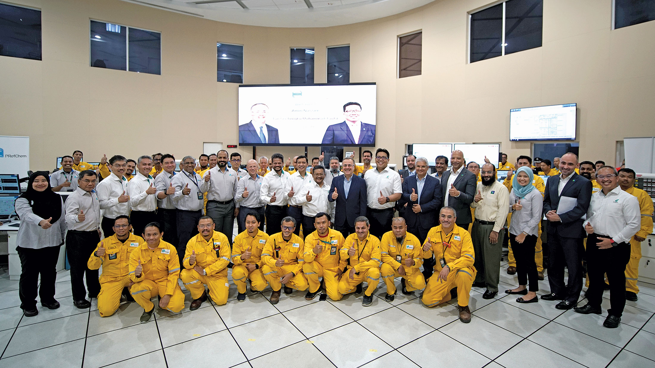 Petronas employees in a group photo with Amin Nasser