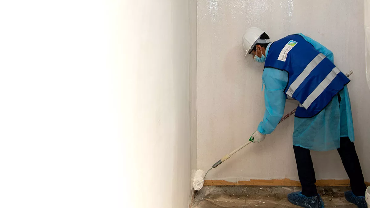 1-Dhahran-ITC-Volunteer-painting-burnt-out-home