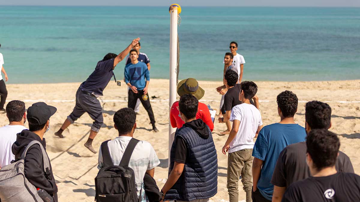 Aramco CPP students play volleyball on the beach