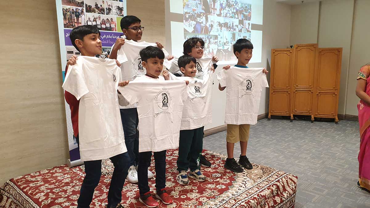 Dhahran Chess Group annual meeting and event 50th anniversary young chess players with new logo