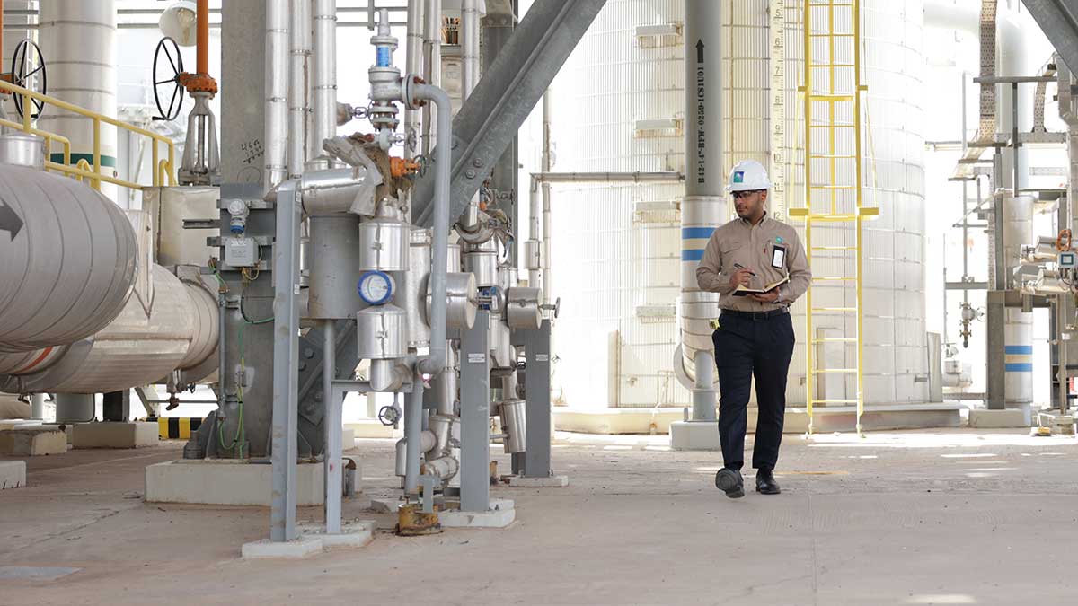 Aramco energy coordinator Abdullah Al-Zahrani focuses on his work in Khurais