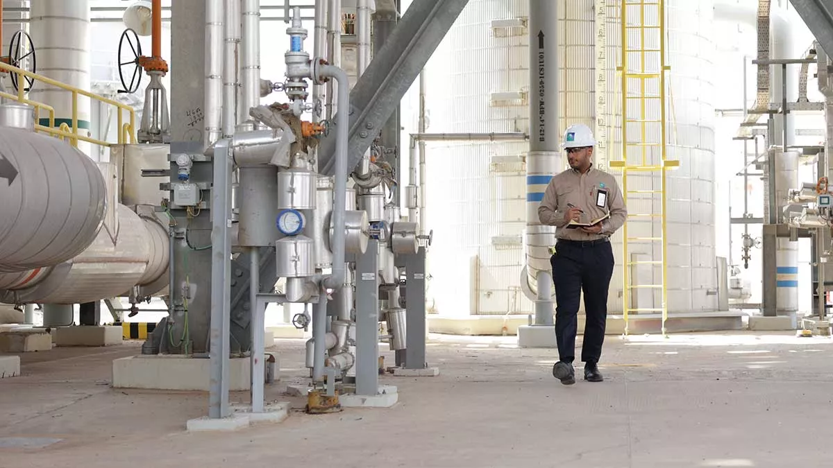 Aramco energy coordinator Abdullah Al-Zahrani focuses on his work in Khurais