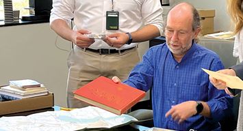 Loss Prevention’s Richard Bartlett works to ensure historic safety posters preserved