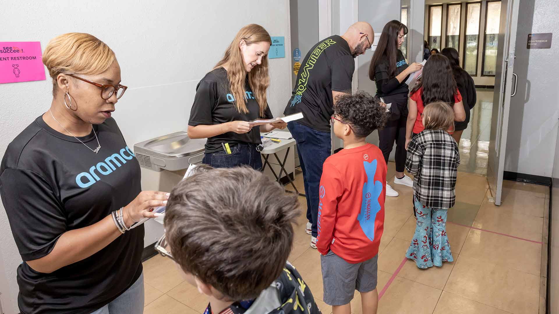 Aramco Americas volunteers help Houston children with eye exams and glasses