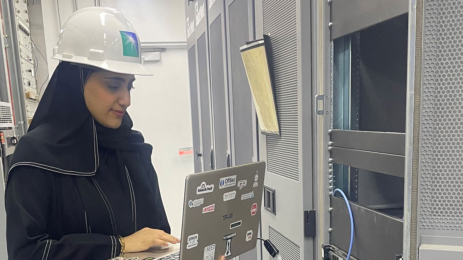 Female cybersecurity analyst leads remote on-site offensive cybersecurity assessment project in Tanajib